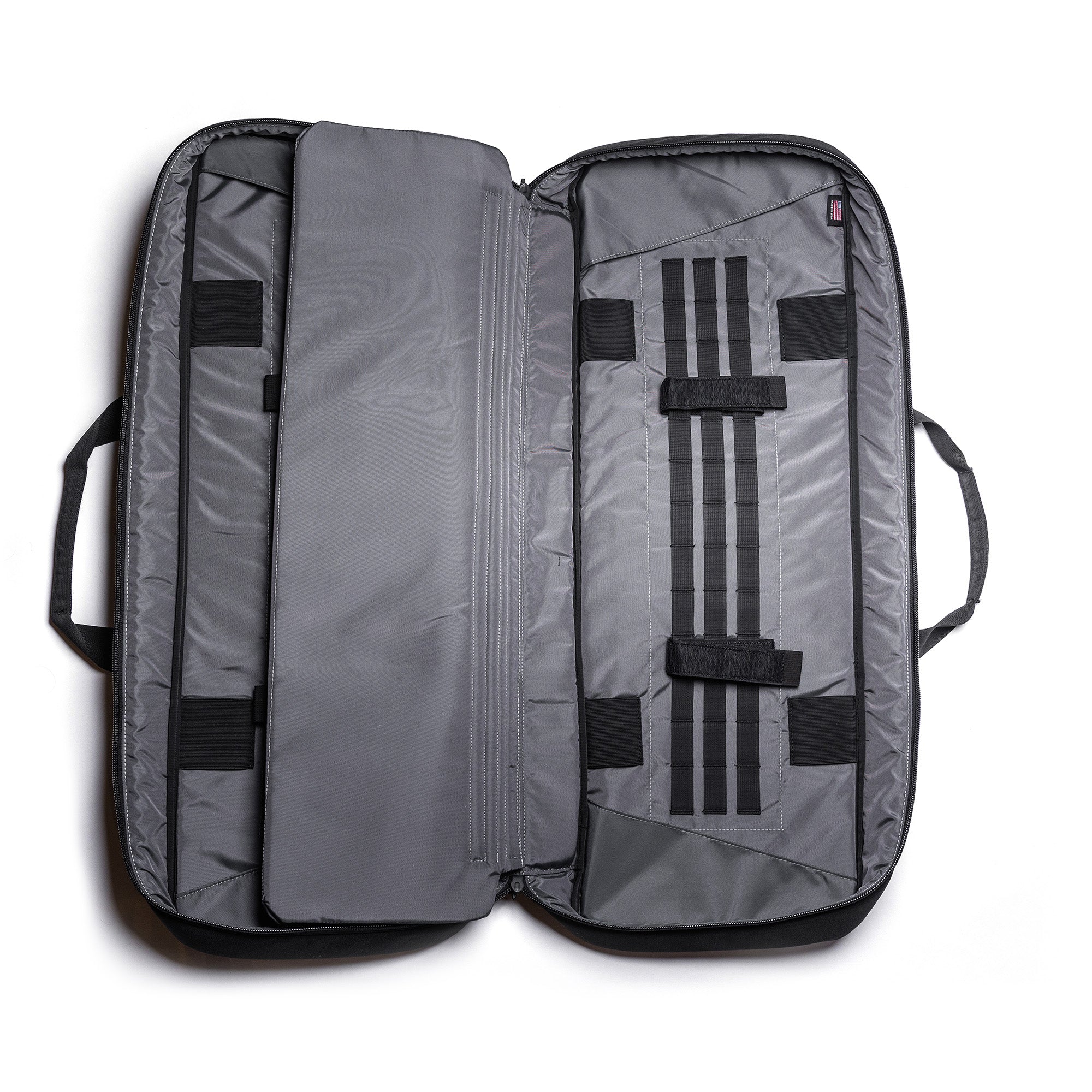 Open gray Lone Star 36" rifle bag with multiple compartments, straps, and padded interior for firearm storage.