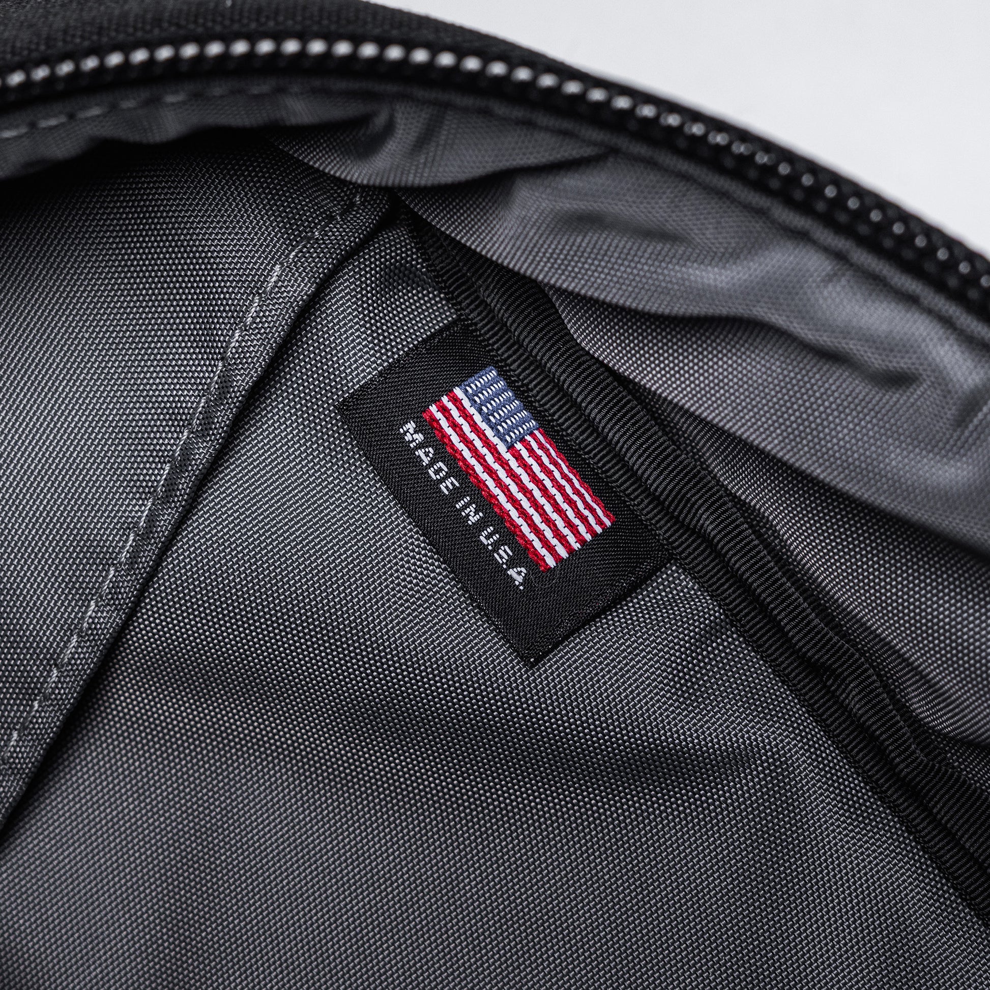 Close-up of the interior of a black Lone Star 36" rifle bag with a US flag label and "Made in U.S.A." tag visible.