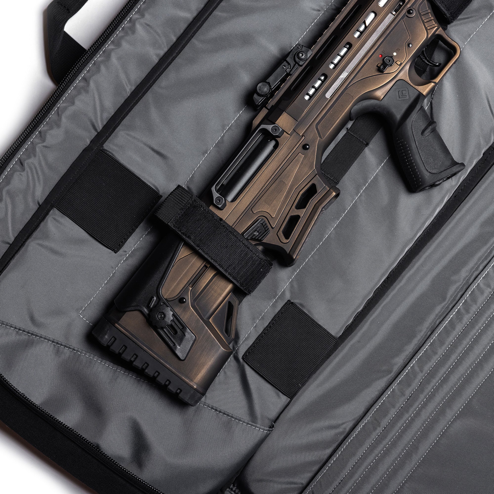 Gray Lone Star 36" rifle bag with adjustable straps, padded interior, and a firearm securely held inside.
