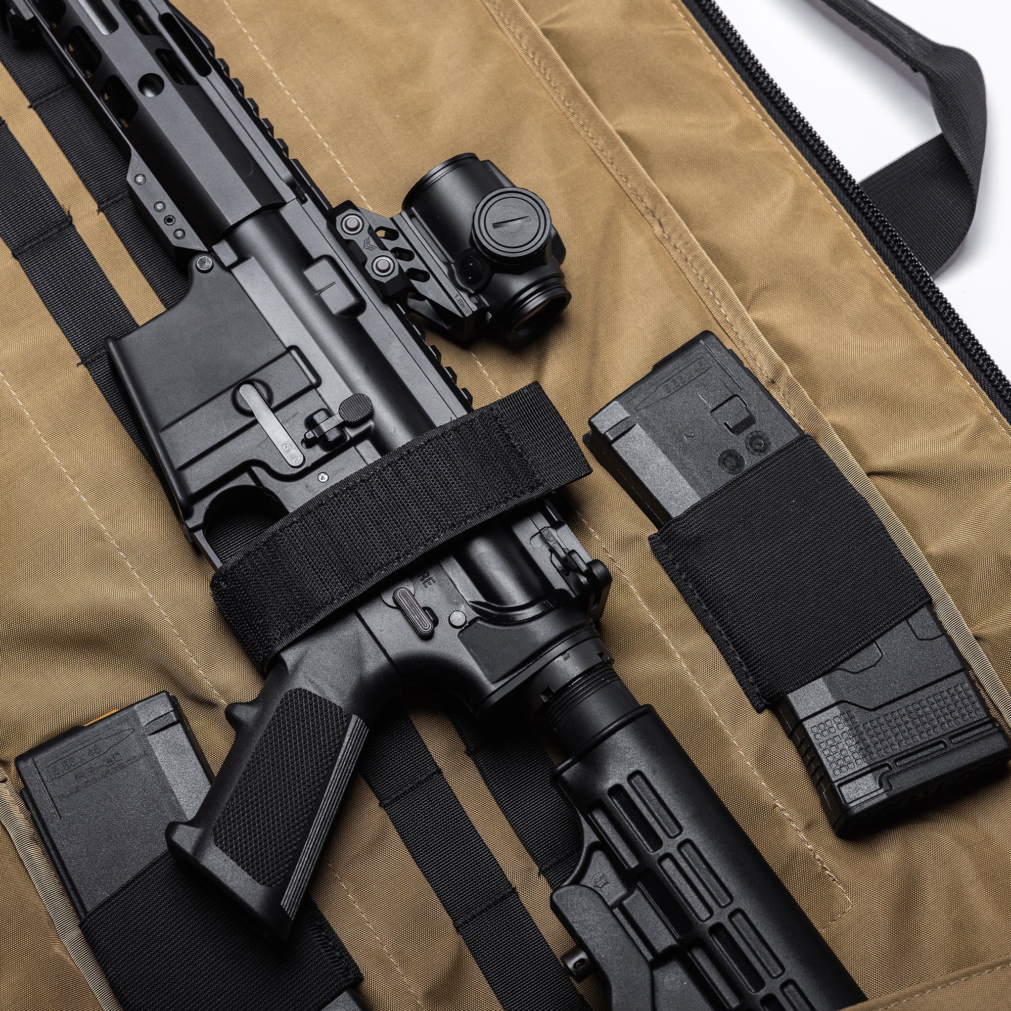 Lone Star 36" rifle bag with a black rifle, magazines, and accessories inside, padded interior, and secure straps.