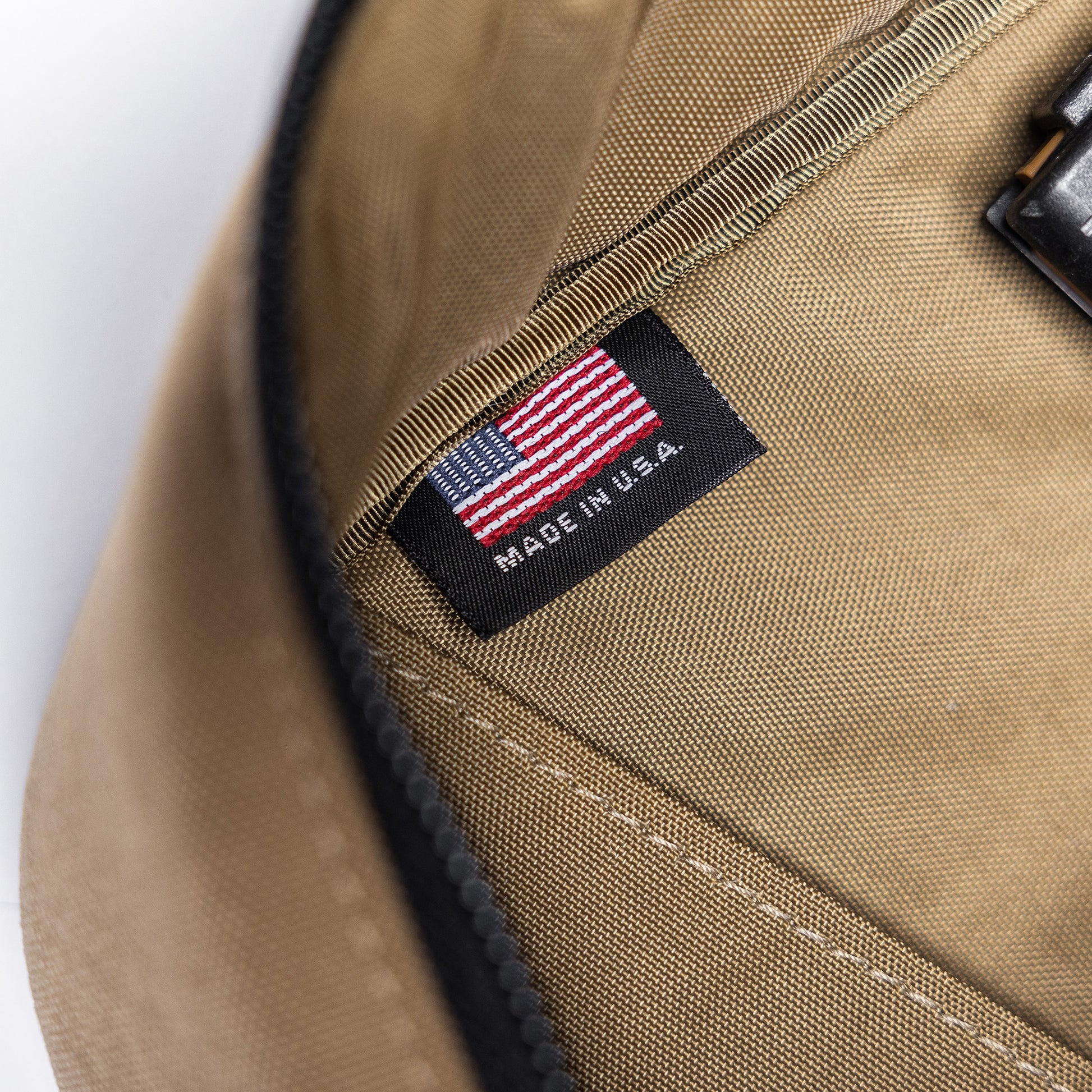Close-up of a tan Lone Star 36" rifle bag with a black label featuring an American flag and "Made in U.S.A." text.