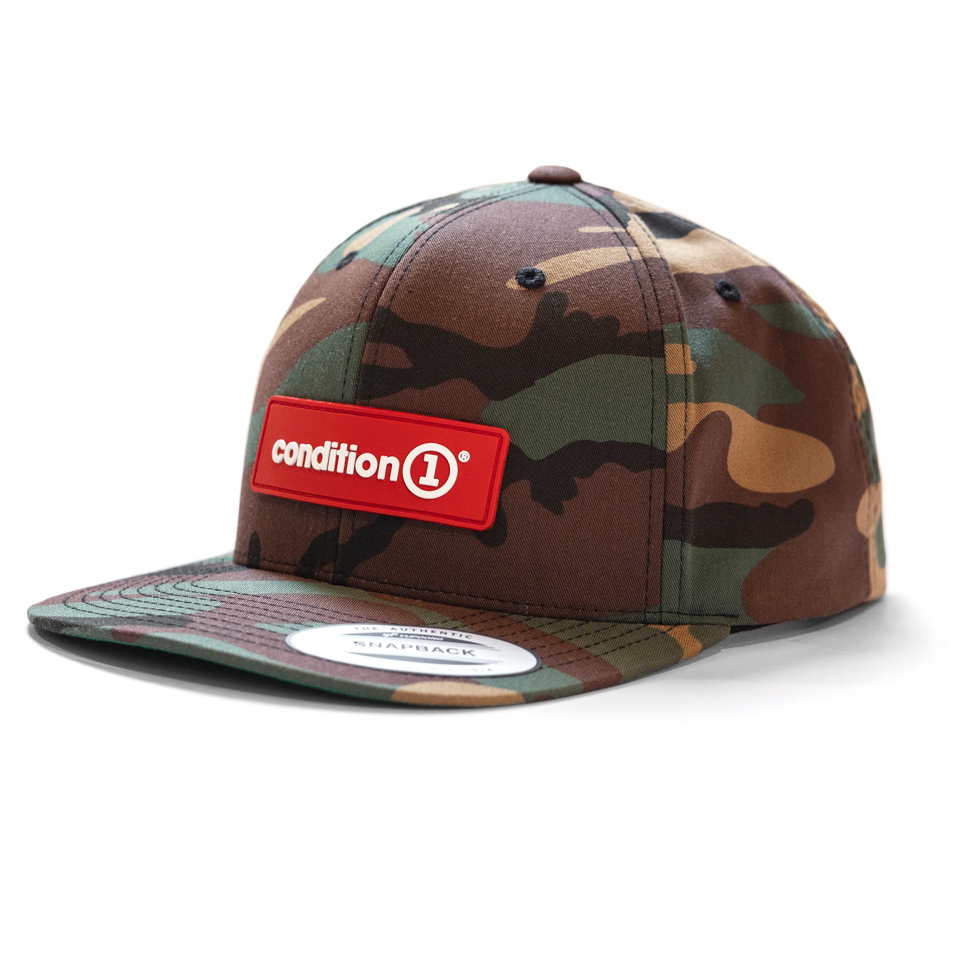Camouflage snapback hat with a red "condition 1" patch on the front and a flat brim, designed for casual streetwear style.