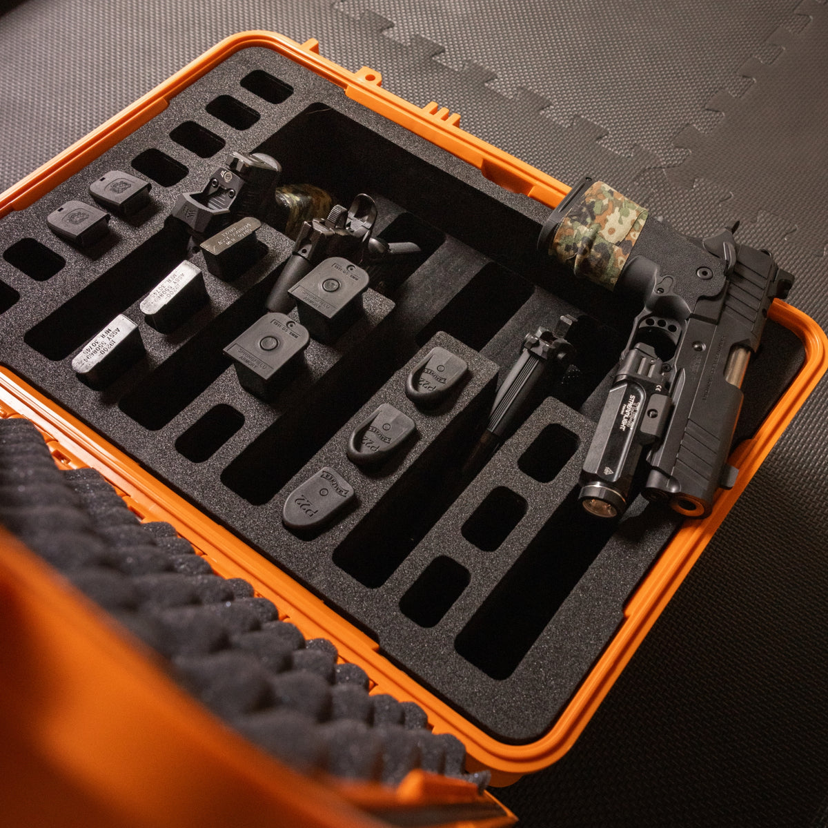 Pre-cut foam insert for #801 case, featuring five slots for firearms and twenty slots for magazines, ensuring secure storage.