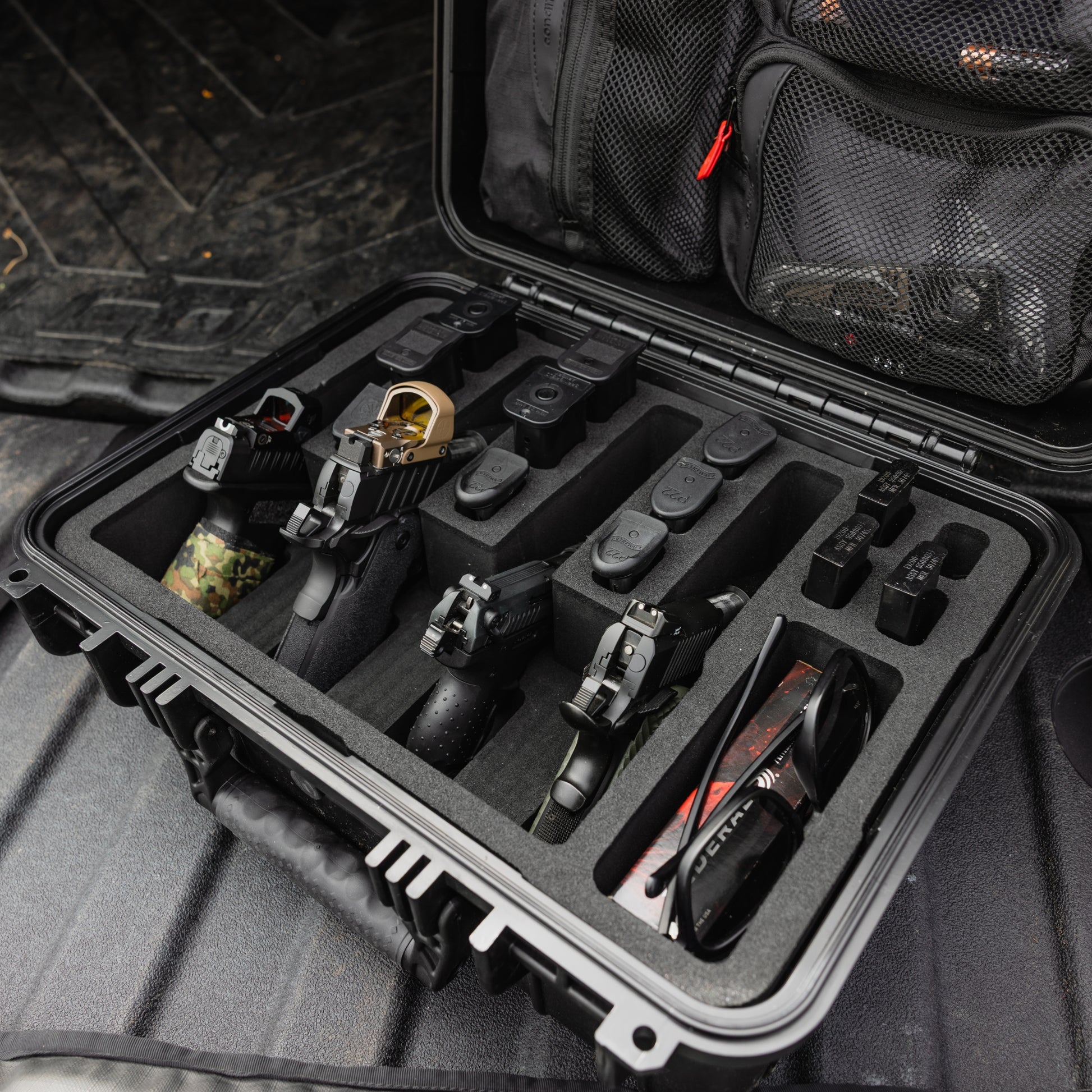 Pre-cut insert for #179 case, securely holding four firearms with additional compartments for accessories and gear.
