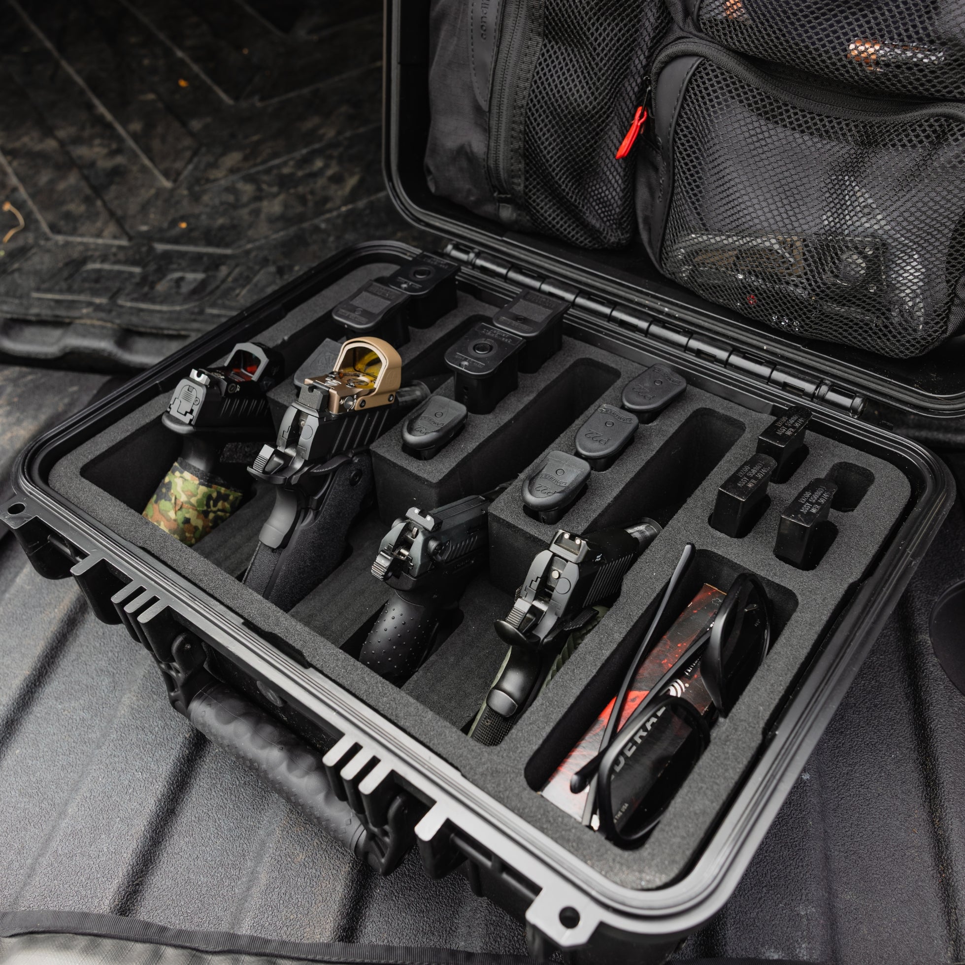 Pre-cut insert for #179 case, securely holding four firearms with additional compartments for accessories and gear.