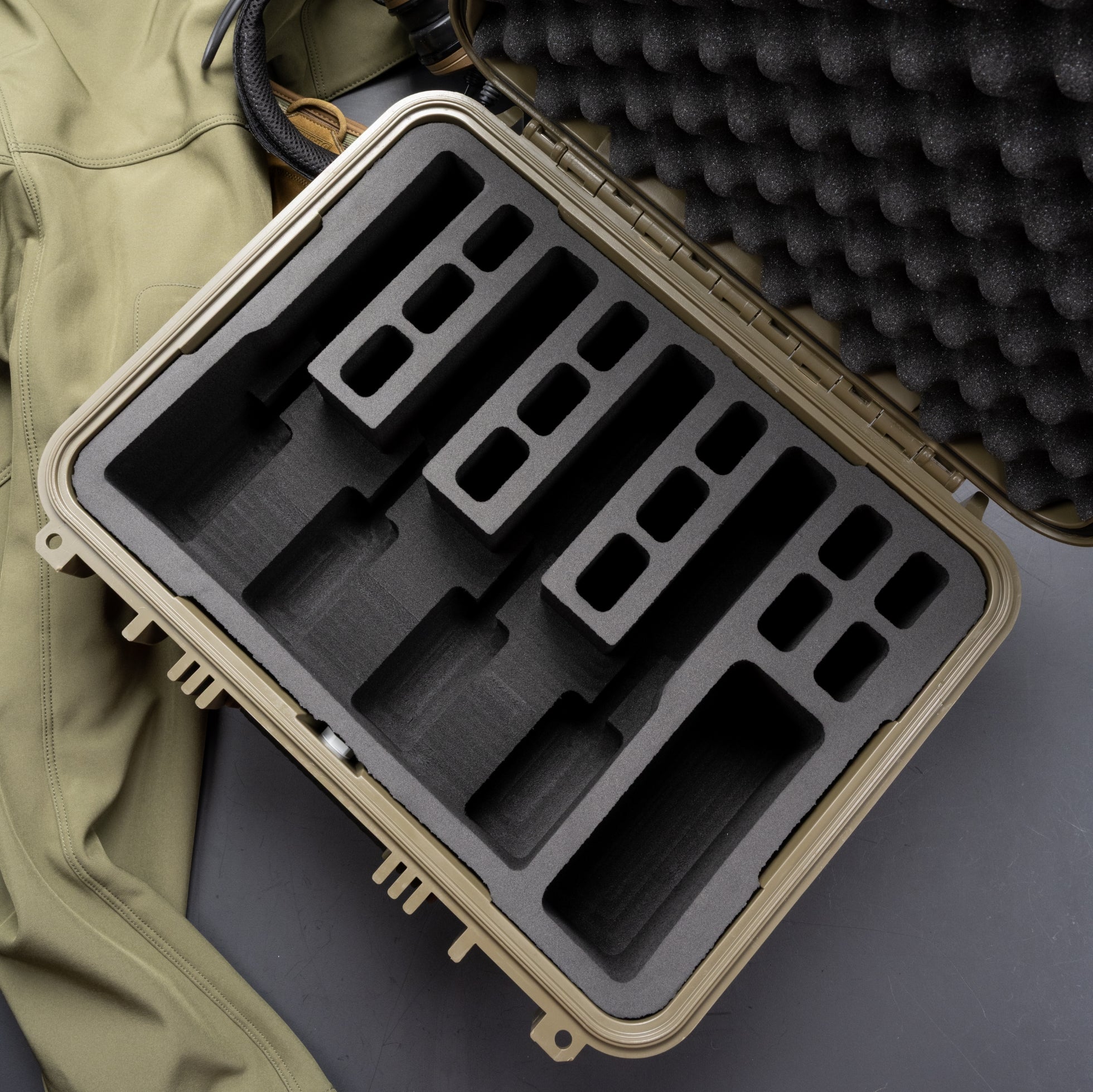 Pre-cut foam insert for #179 hard case, featuring four slots for secure storage of cameras and electronics.