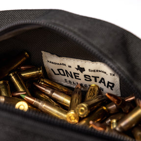 Lone Star Ammo Bag with a label, filled with various ammunition cartridges inside a durable fabric pouch.