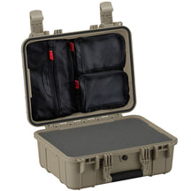Alt text: "Open 16-inch medium protective case #179 in tan with multiple black zippered pockets and red zipper pulls inside the lid, featuring a rugged exterior and a flat foam-lined bottom.”