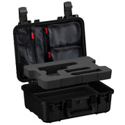 Open black pistol case showing lid organizer pockets above gray pistol-shaped foam insert