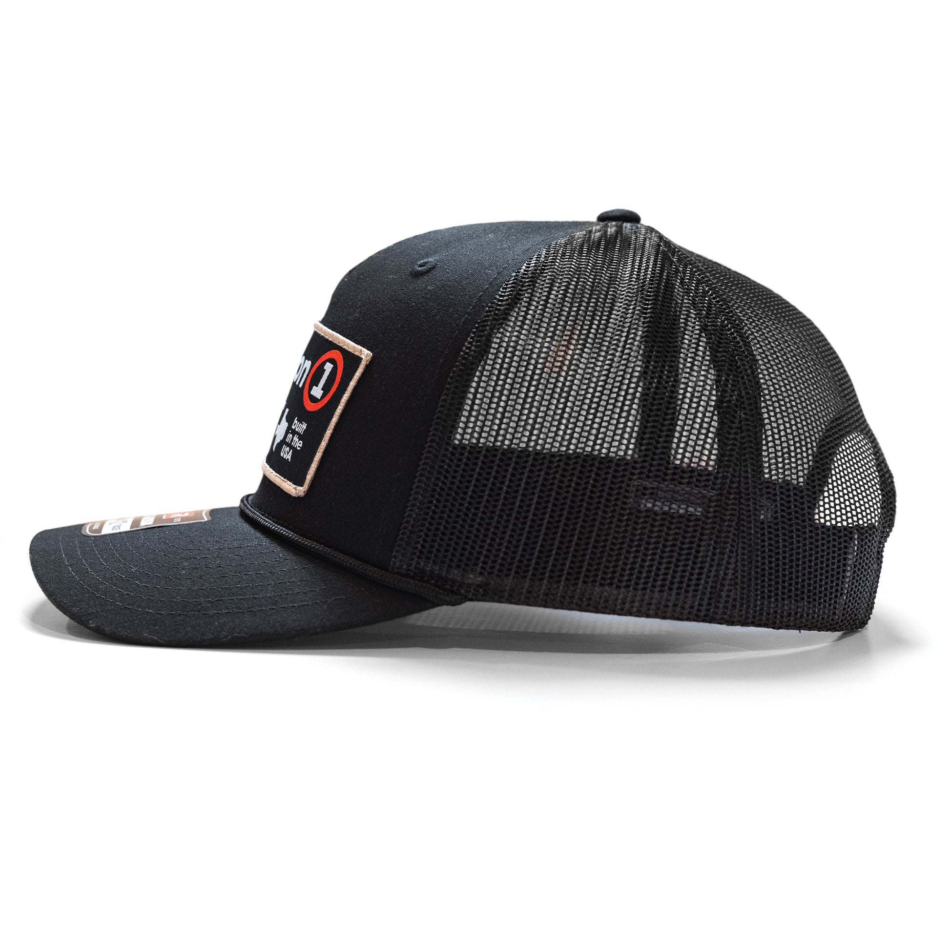 Black snapback hat with a mesh back, front patch, and curved brim, featuring a logo and text design.